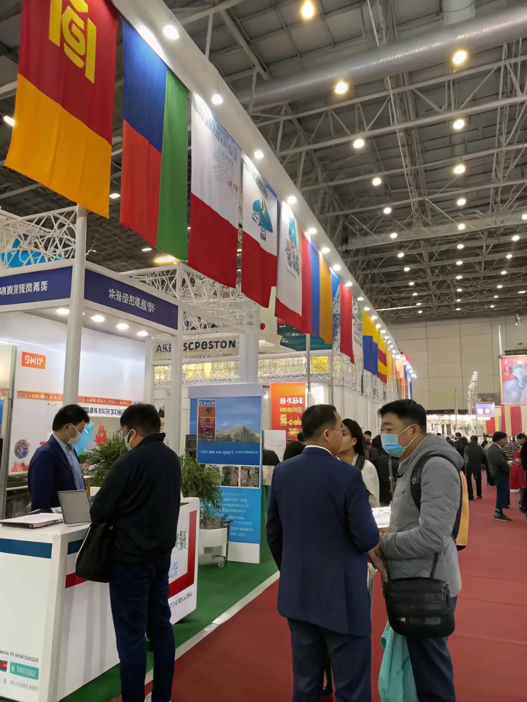 An image of a bustling exhibition hall at a business conference, showcasing various booths and attendees networking.